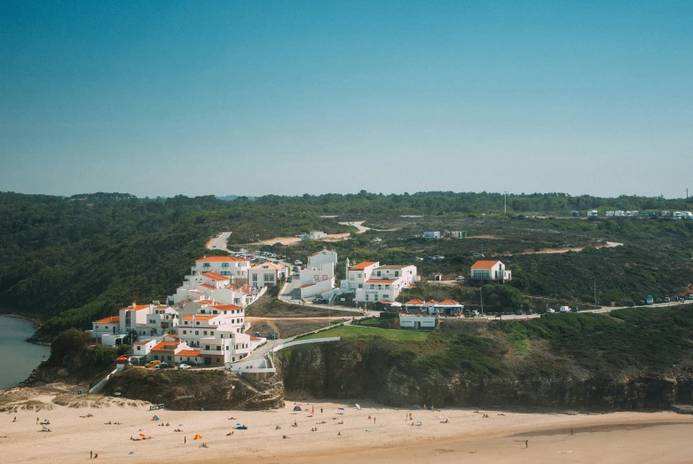 many people are in the sand on a beach