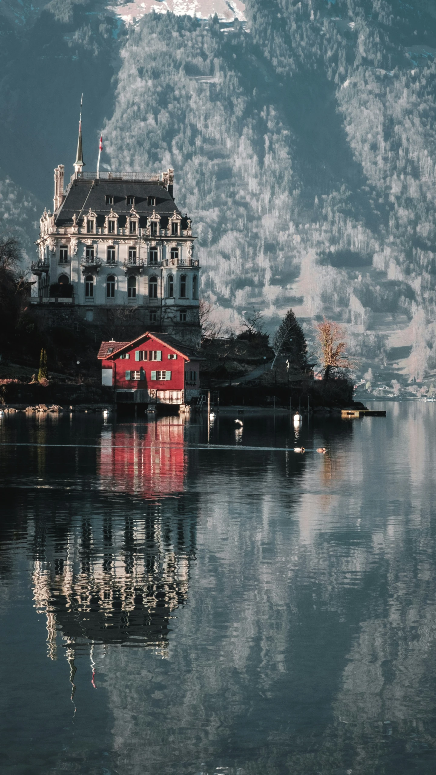 a beautiful lake town with reflections on the water