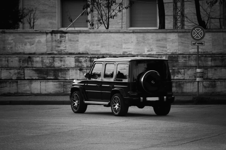 a black car parked in front of a building