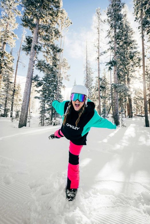 a girl riding skis on top of snow covered ground