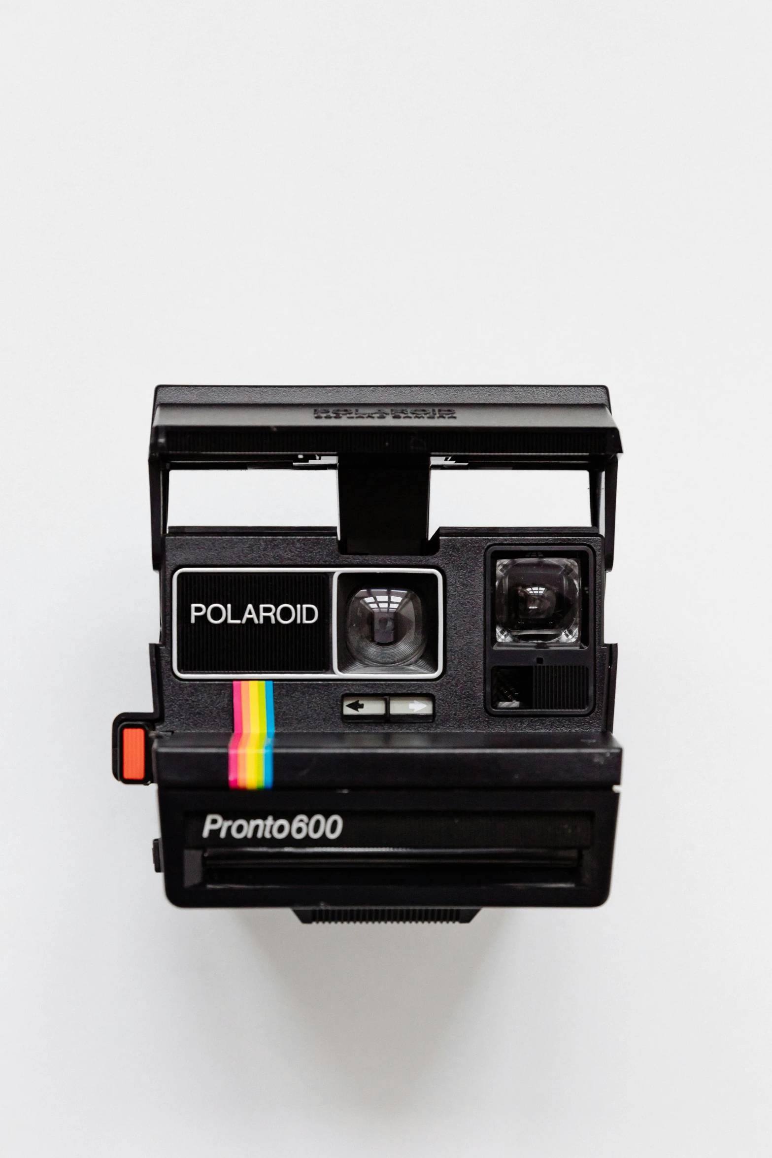 a polaroid camera on the top of a table