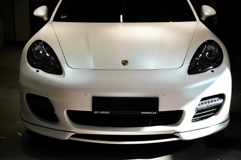 the front of a white sports car