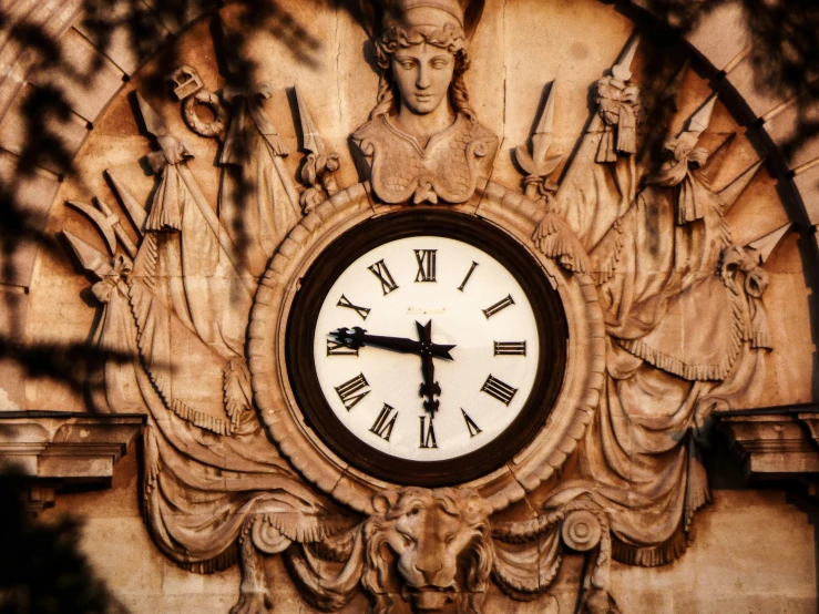 an image of a clock with roman numerals on it