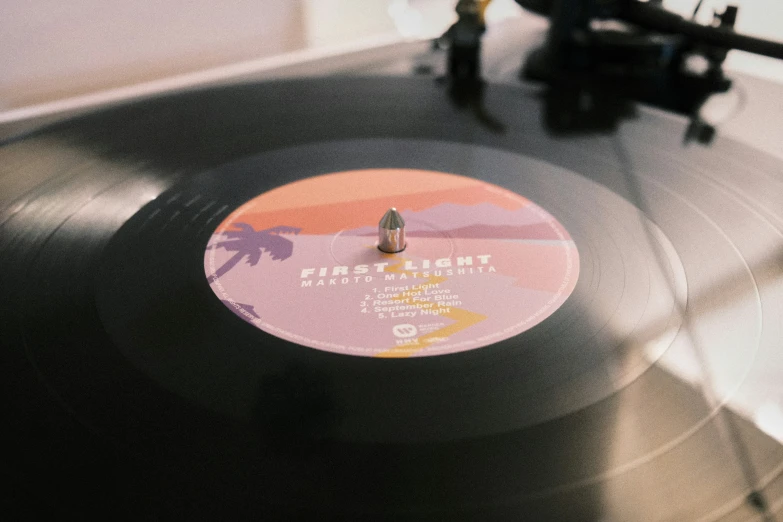 an old record player sitting on top of a table