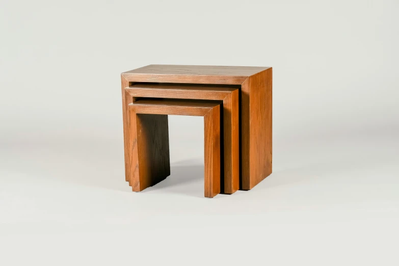 three small wooden tables sitting next to each other