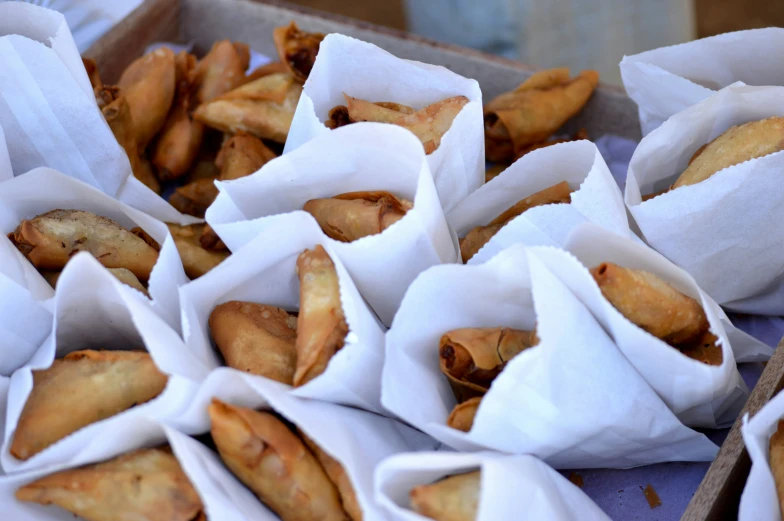 some food items in paper bags stacked together