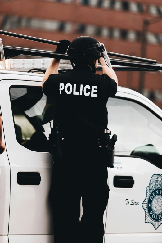 a police officer is working on his vehicle