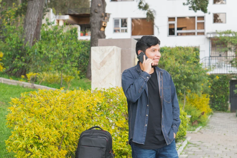 the man has just thrown a phone and it's right next to his backpack