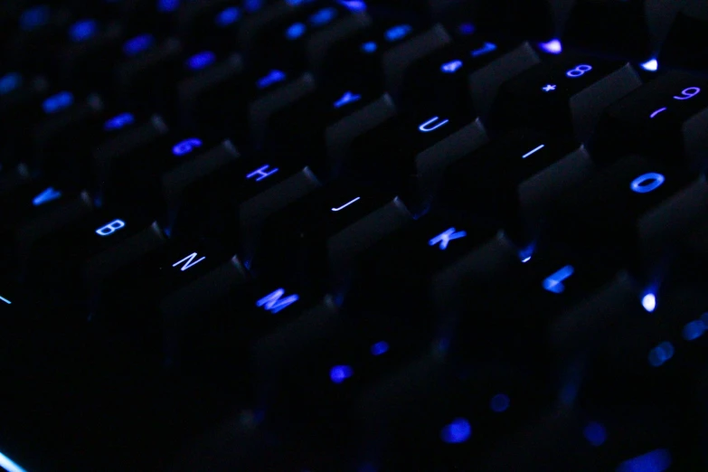 the backlit keyboard is glowing blue with glow