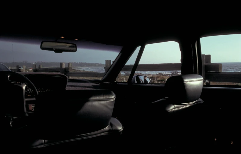 a view from inside a vehicle looking out on the ocean