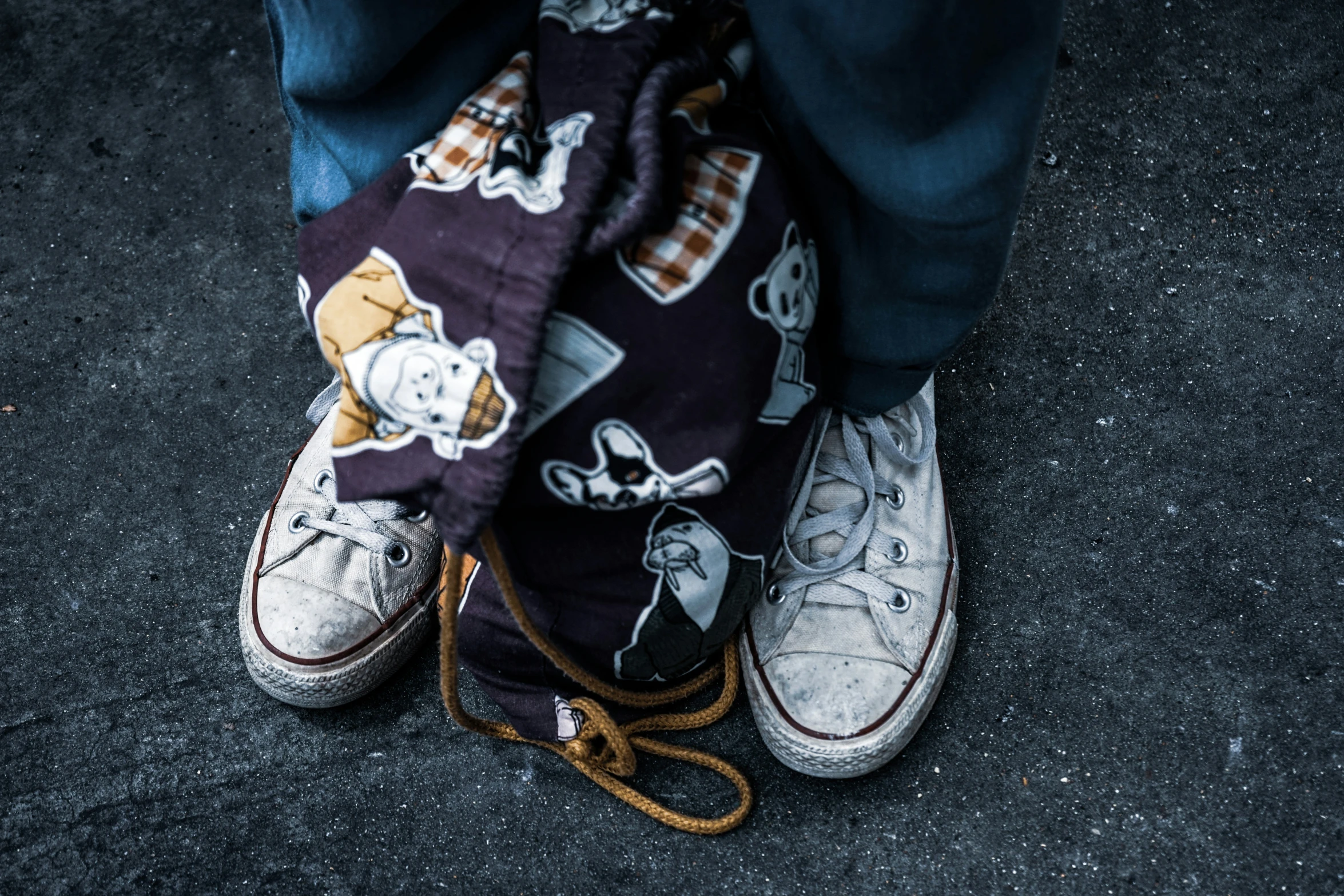 a man is wearing a bag with a picture on it