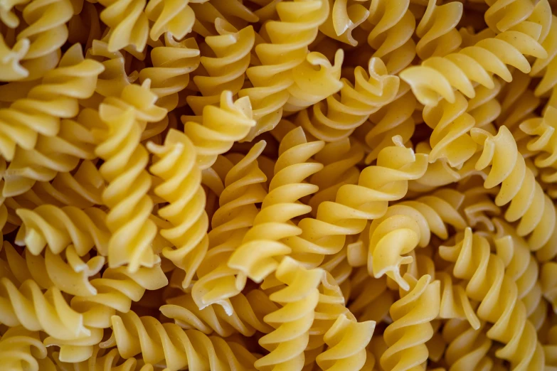 closeup of a pile of yellow colored noodles