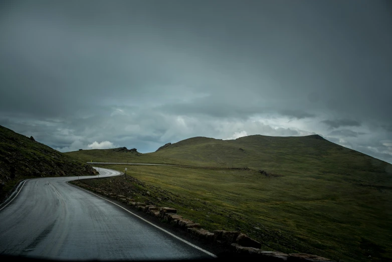 the landscape has a dark cloud in the sky