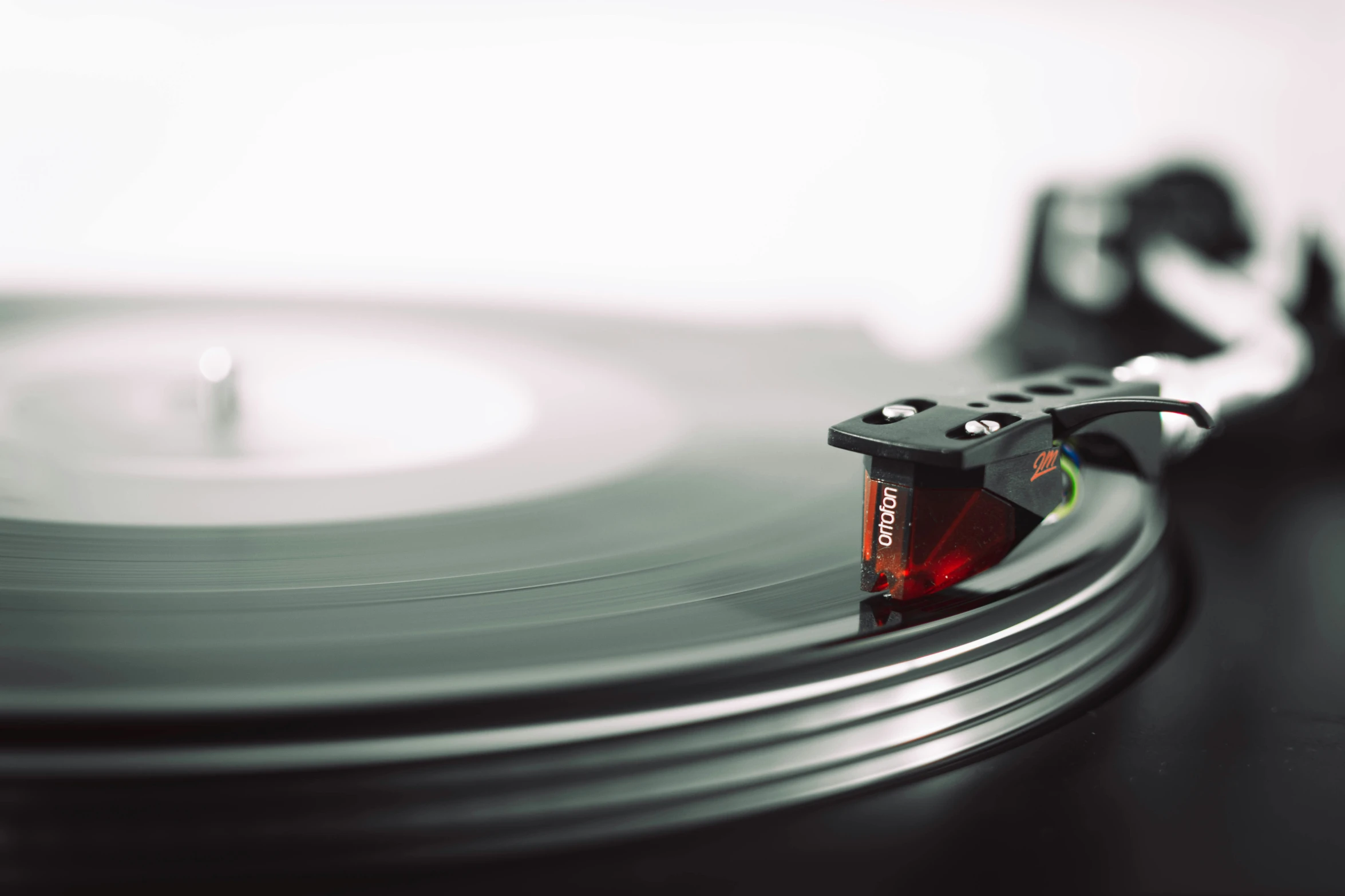 a record player is shown with the disk in position