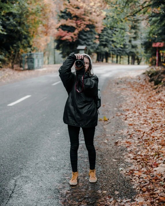 a woman is taking a po on her camera