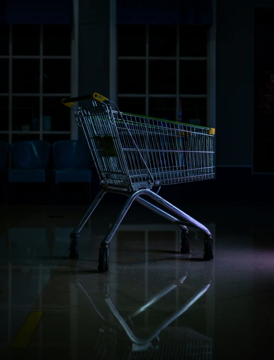 an empty shopping cart in the dark