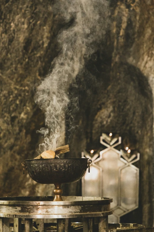 smoke rising from a bowl over some chairs