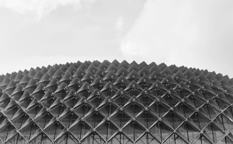 a close up of a metal structure on a cloudy day