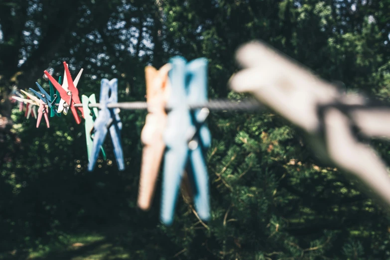 colorful clothes pegs hanging on the clothes line