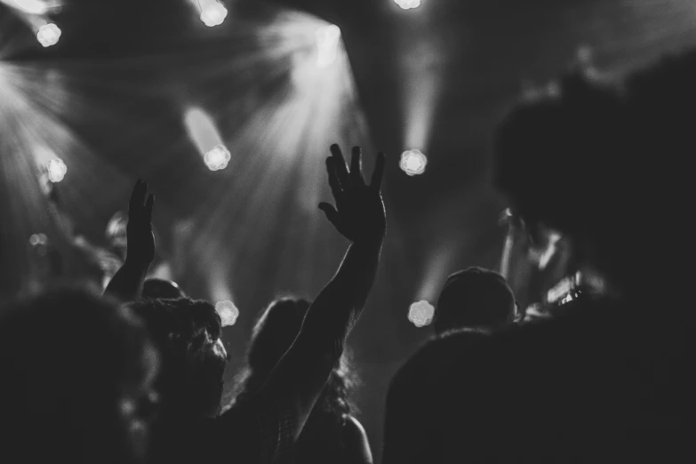 a black and white po of people at a concert