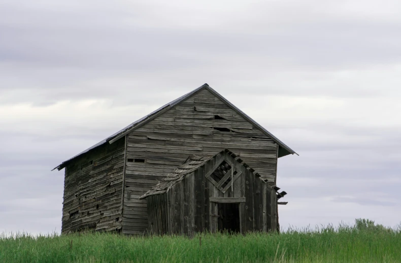 an old building in the field that has been  off