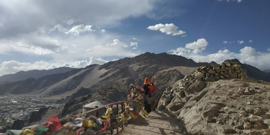 people in full vests hiking on top of mountains