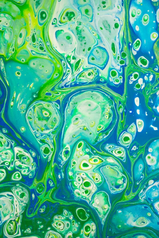 an abstract liquid painting on top of some kind of paper