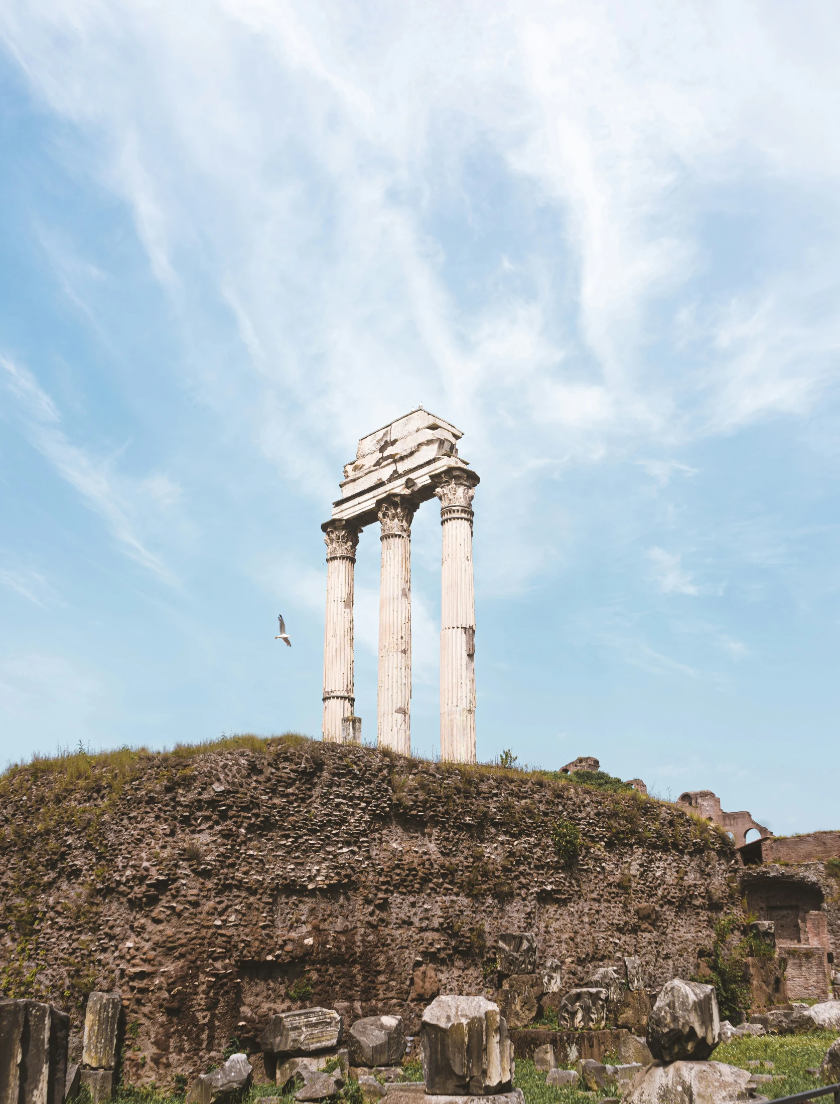 a large stone tower with some pillars on it