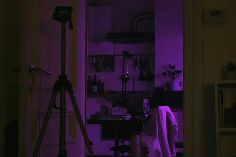 the pographer is working in his room purple light