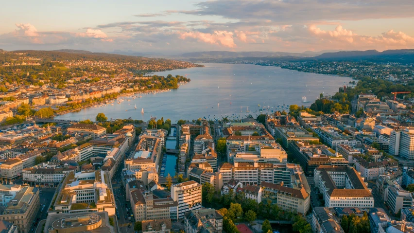 a large group of buildings and an waterway in the distance