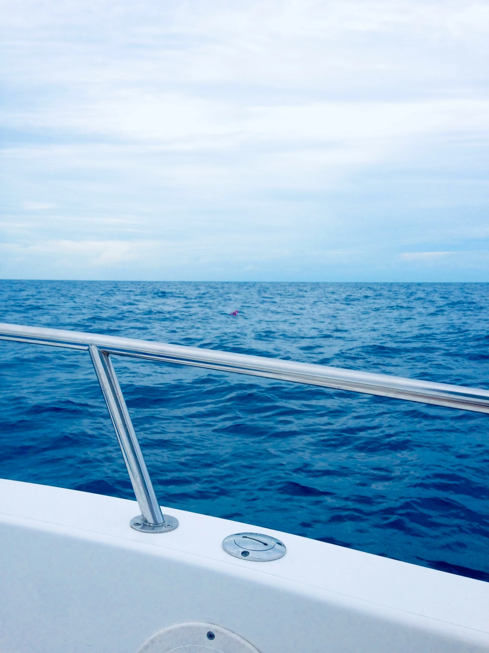 view of the side of a boat in open ocean