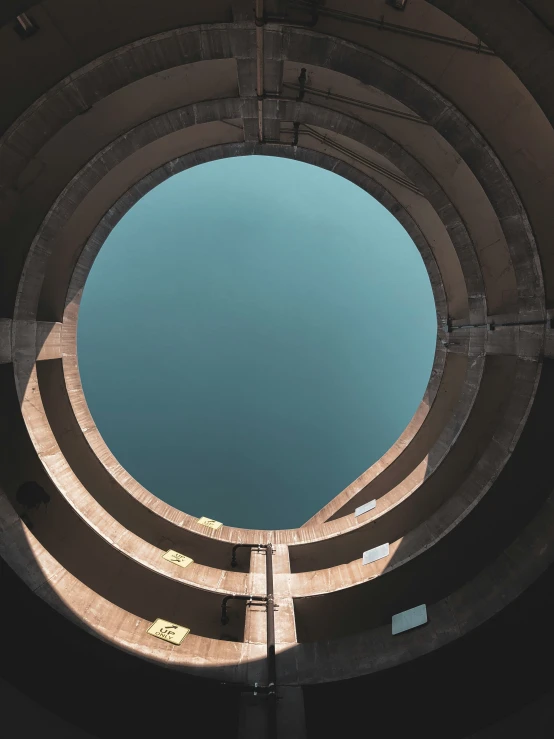 a circular opening in an open concrete tunnel