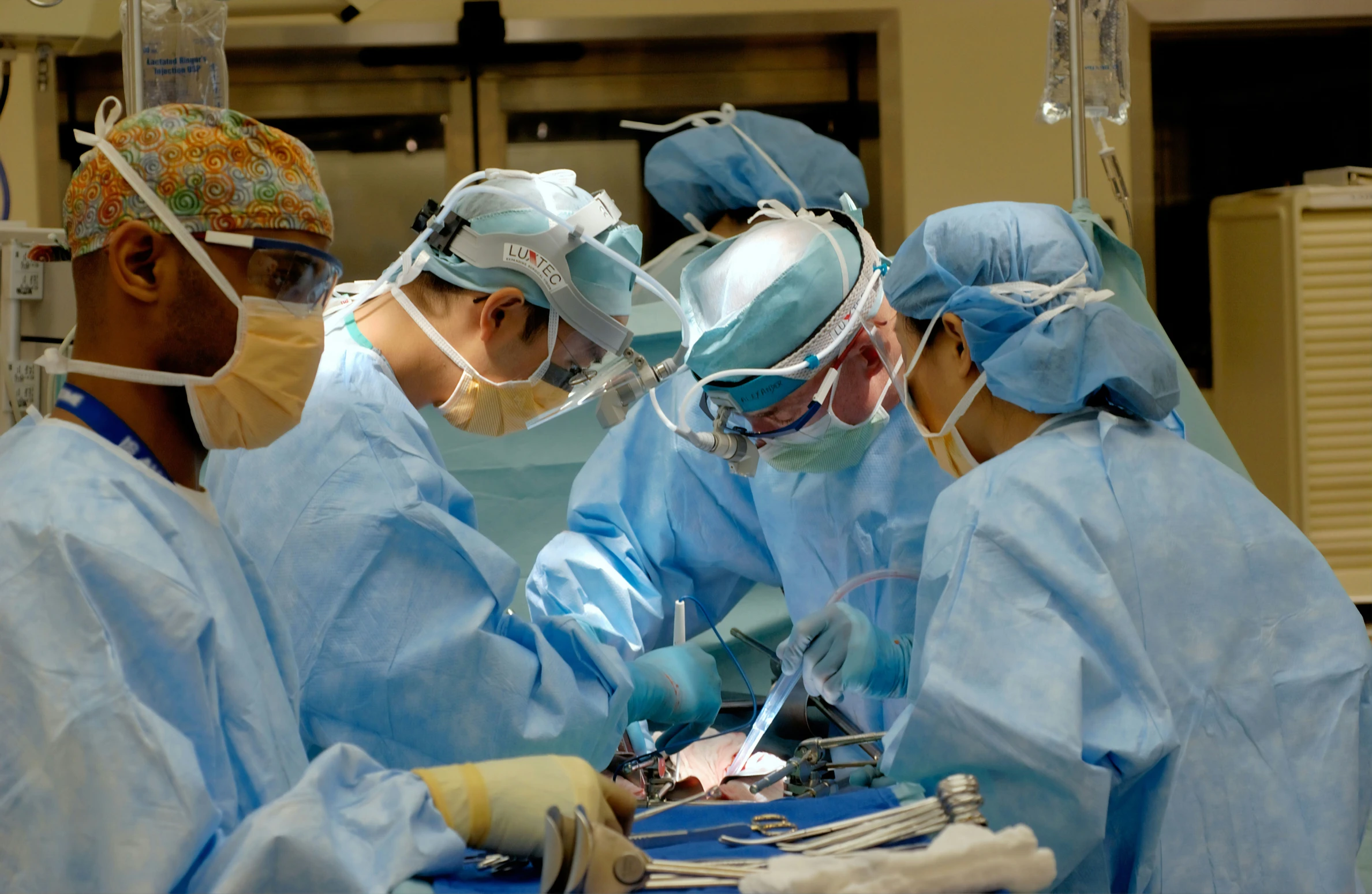 doctors performing  in an operating room