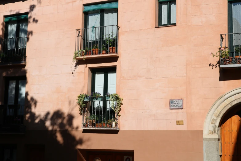 an apartment building is shown with windows and balcony balconies