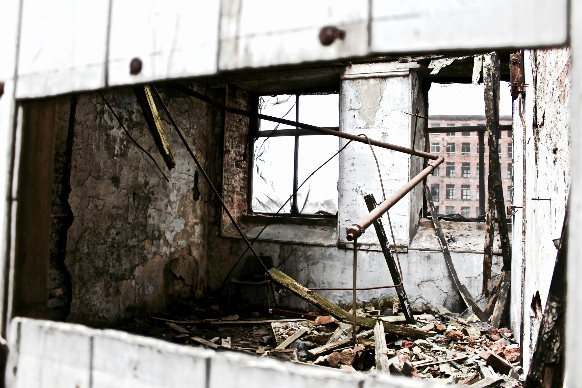 a dilapidated area in a large building that is mostly white