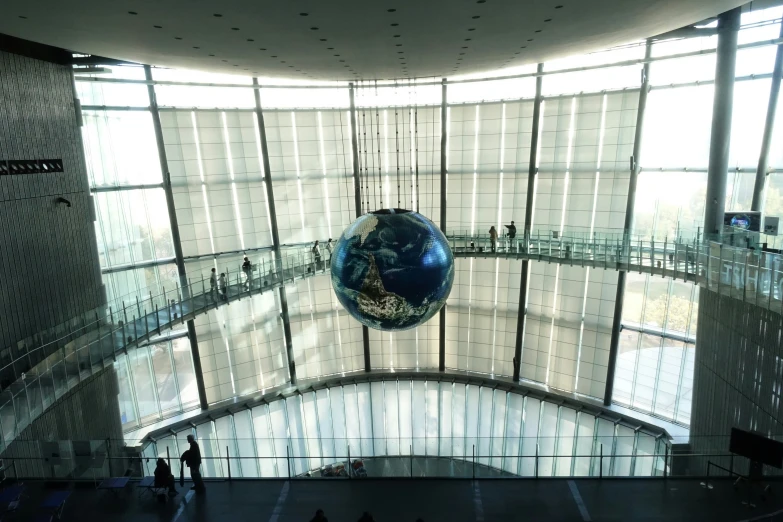 there is a blue and silver ball hanging from the ceiling