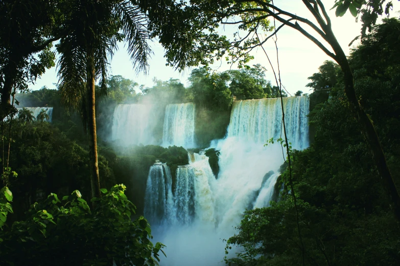 a waterfall with water pouring out of the side