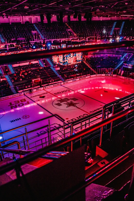 the hockey rink at night is lit up