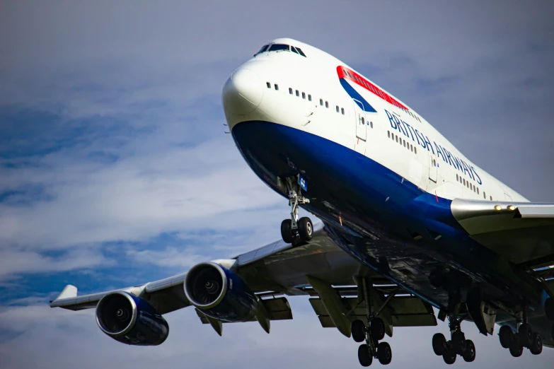 an airplane flying with the landing gear down