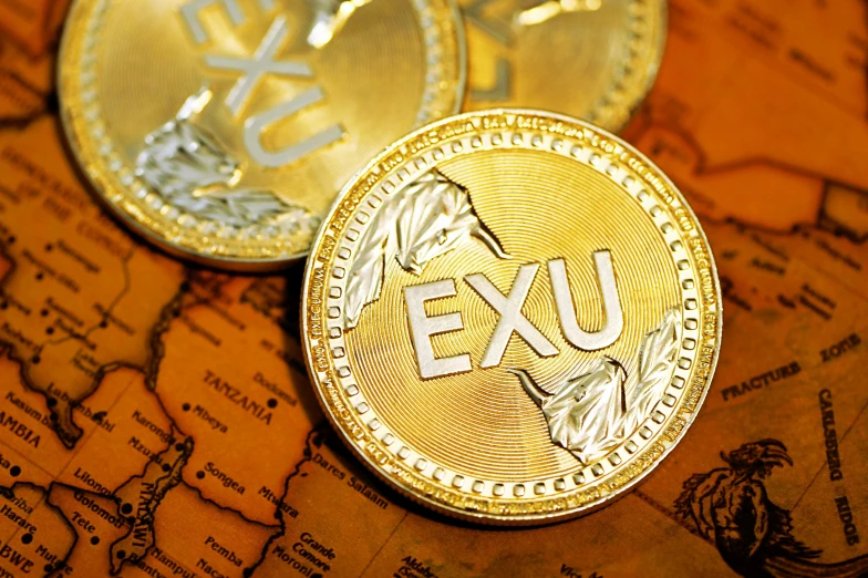 two euro coins sitting on top of a map