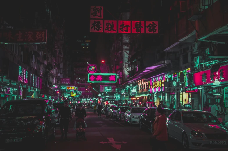 a group of people standing around a busy street