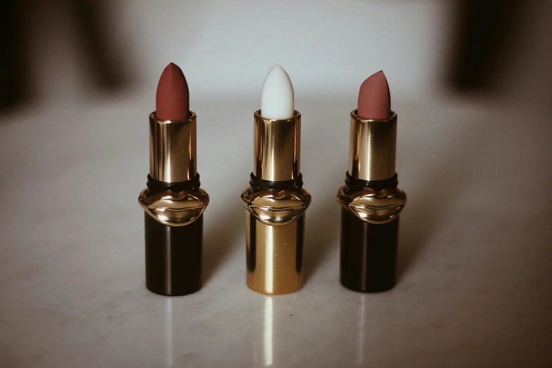three lipsticks that are all different colors