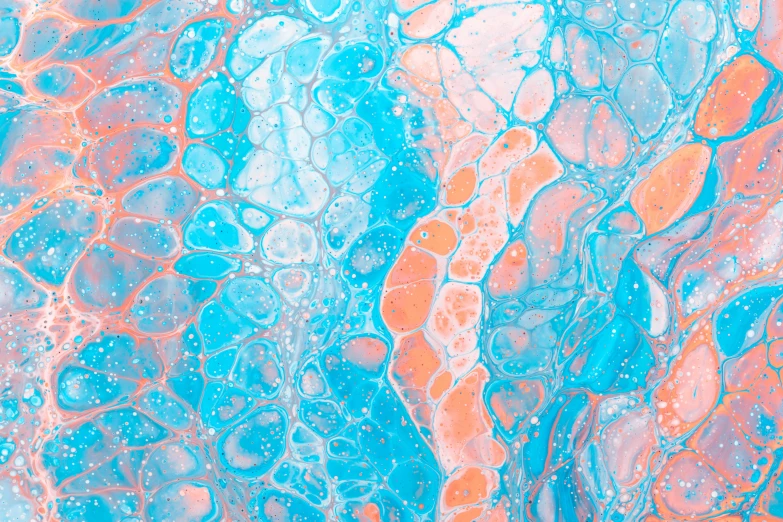 blue and orange paint swirled on top of each other