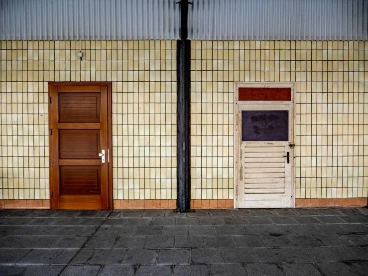 two doors open outside of a building