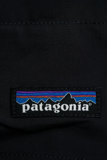 the patagonia sticker is shown on a black bag