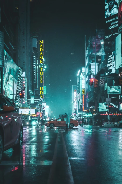 cars on the street in a city at night