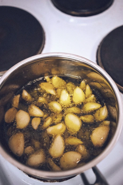 a pot of food cooking on the stove