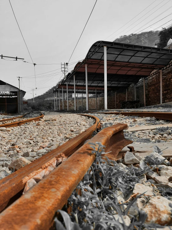 a train track with wire above and below