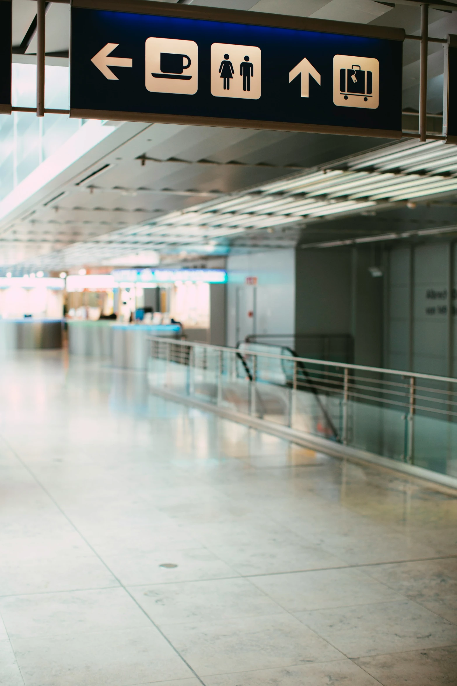 signs on the inside of an airport directing passengers