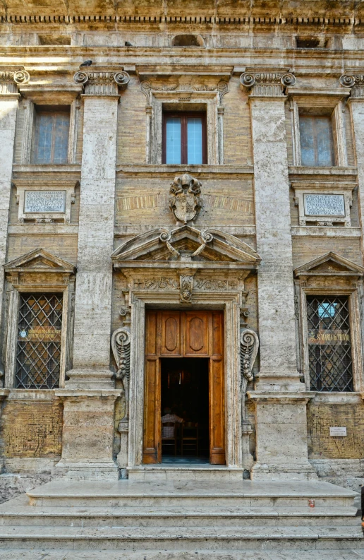 a very large fancy building with fancy carving on it